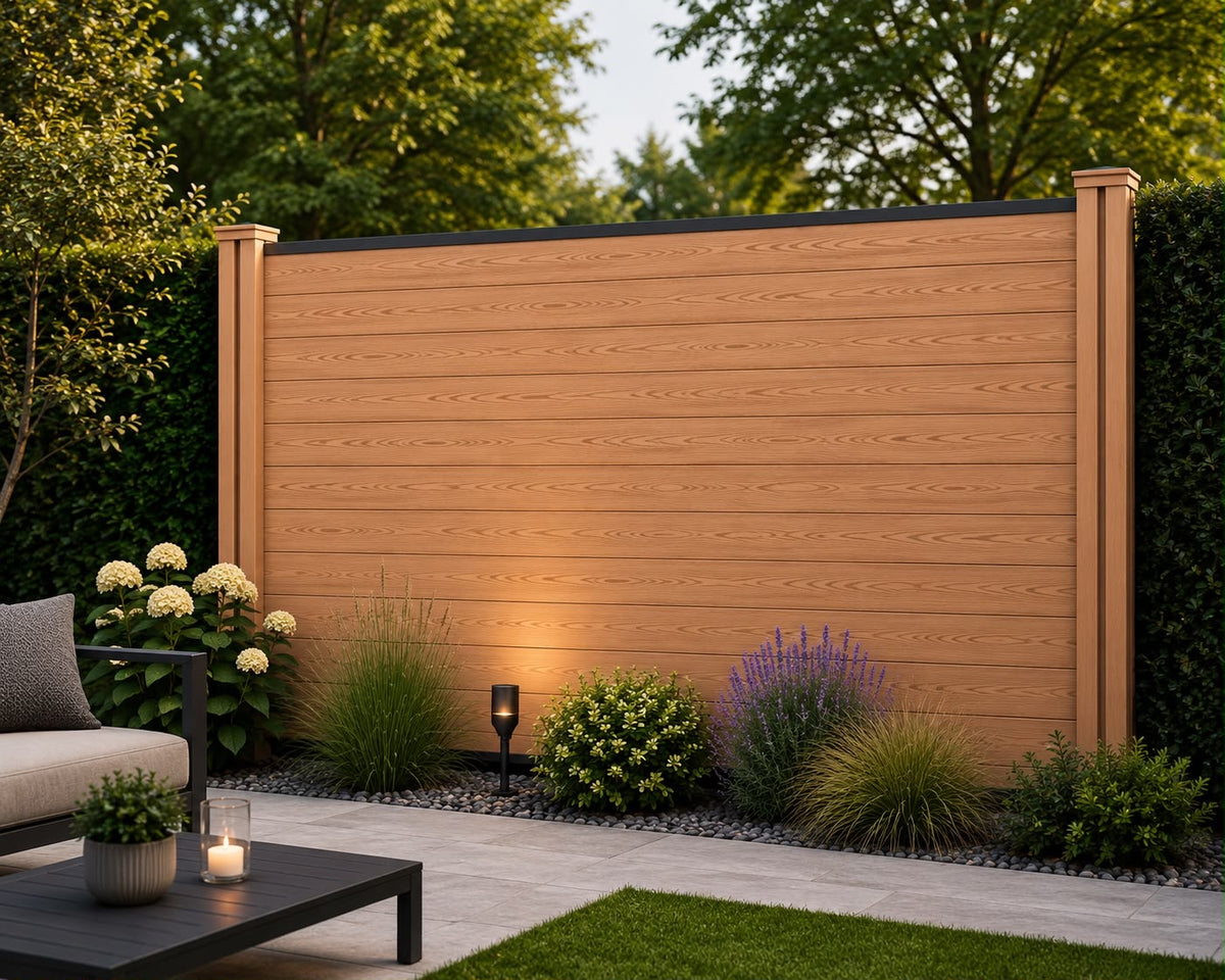 Dark Teak composite fencing with horizontal brown wood-grain slats, matching posts and a black top rail, behind a planted garden border beside a patio.